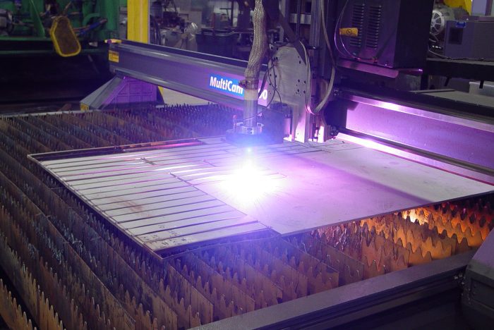 plasma table in the process of cutting aluminum plates